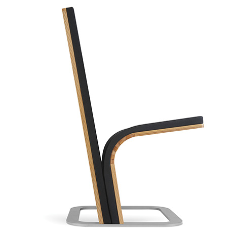 JumpSeat Standard with black upholstery in a side view with moveable base and lowered seat